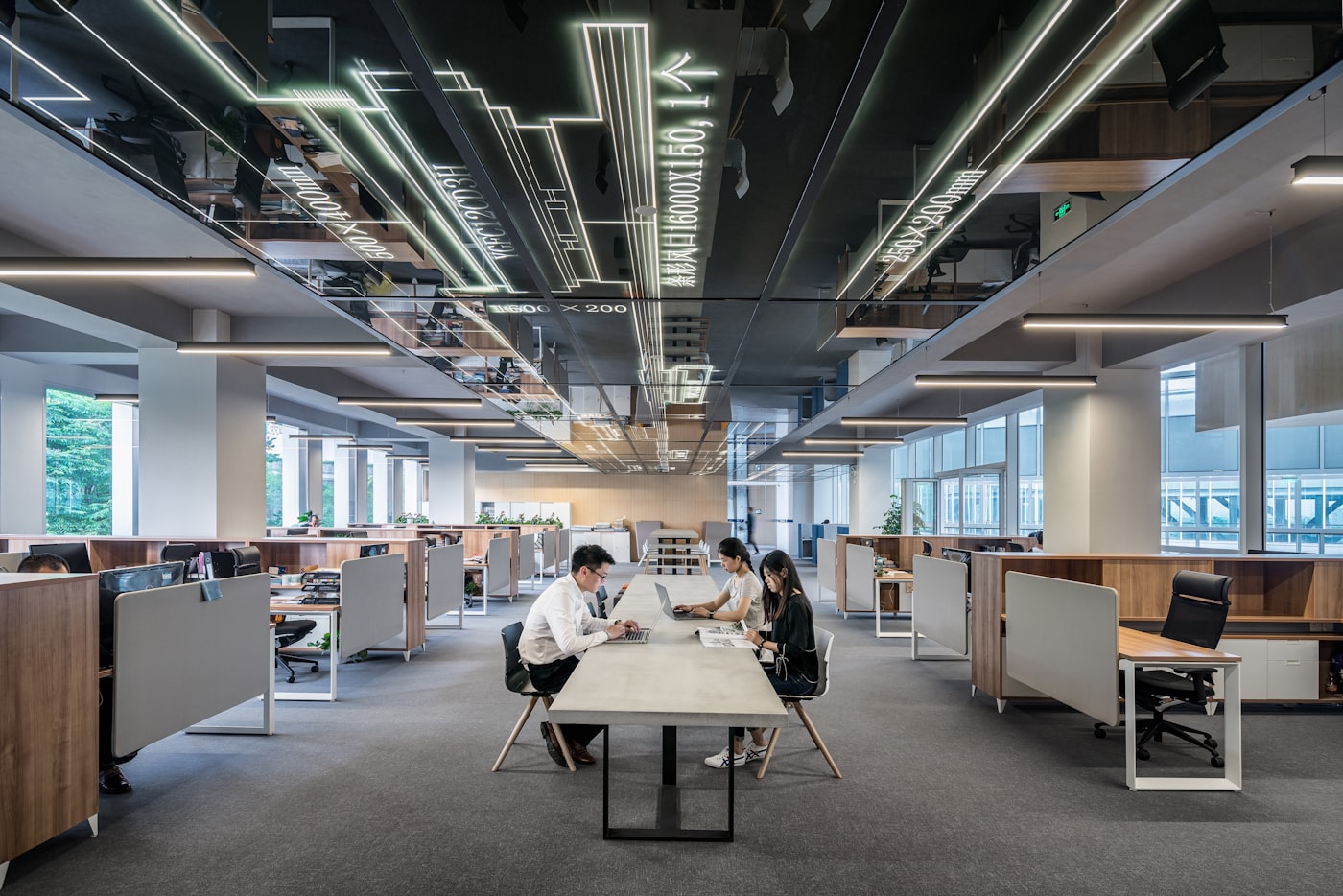 Engineering workspace with code on screen